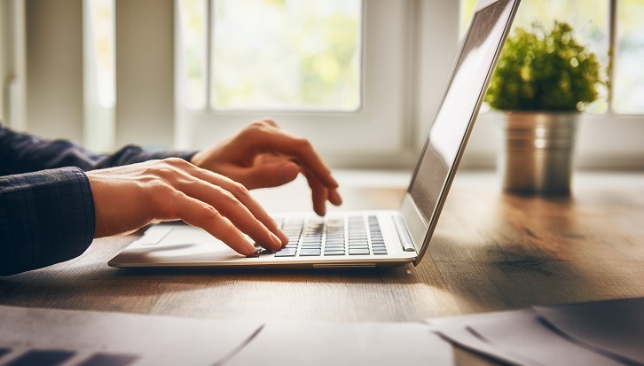 businessman using laptop computer sitting working office.
